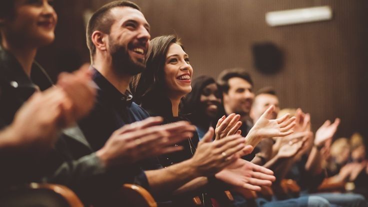 Audience applauding at a professional event